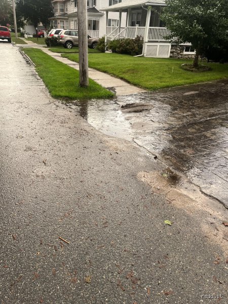 How to Get Rid of Standing Water at the End of a Driveway: A Permanent Engineering Guide to Defeating the Puddle